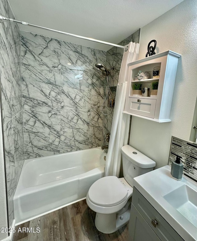 full bathroom featuring hardwood / wood-style floors, shower / tub combo with curtain, decorative backsplash, vanity, and toilet