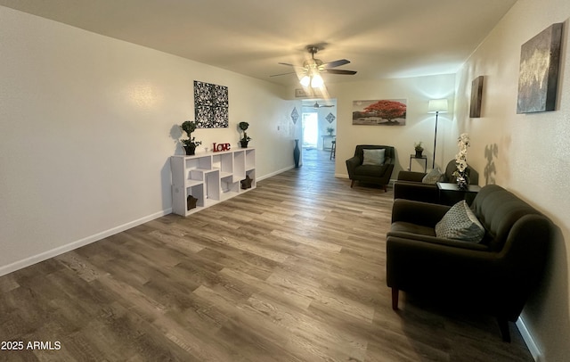 living room featuring hardwood / wood-style flooring and ceiling fan