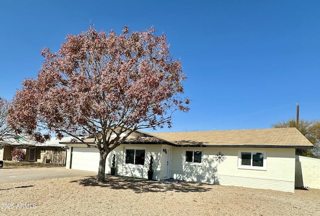 single story home with a garage