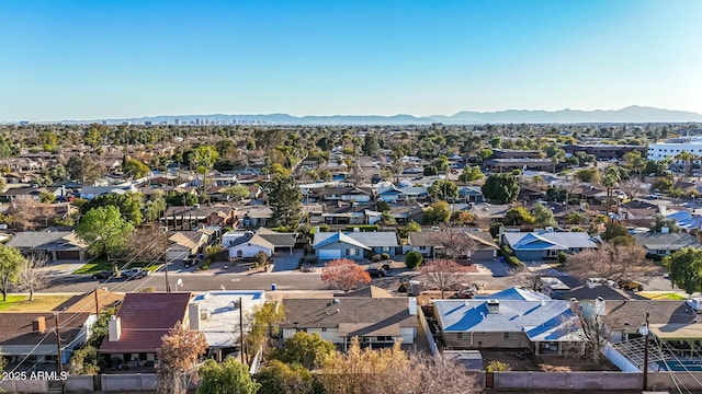 birds eye view of property featuring a mountain view