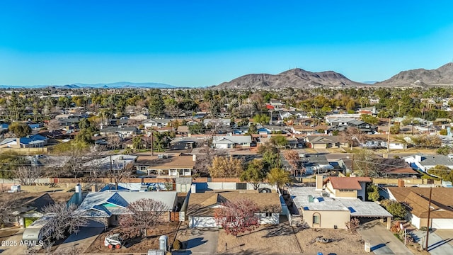 birds eye view of property with a mountain view