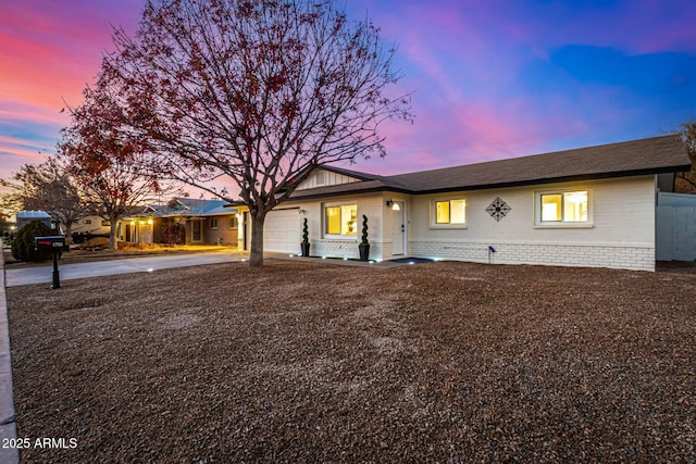 ranch-style house featuring a garage