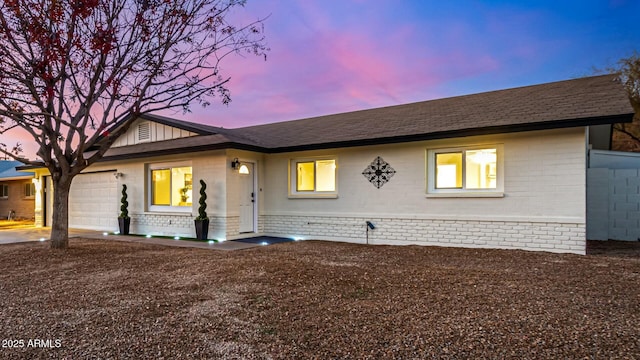 ranch-style house featuring a garage