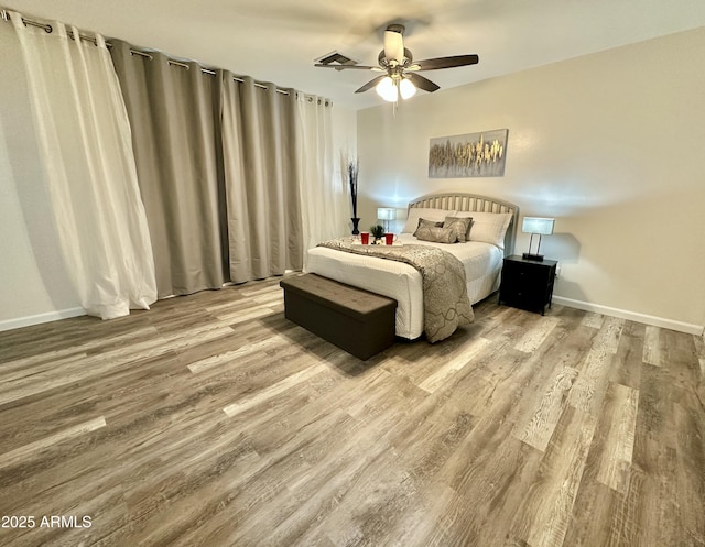 bedroom featuring ceiling fan and light hardwood / wood-style flooring