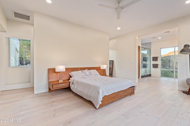 bedroom featuring ceiling fan and light wood-type flooring