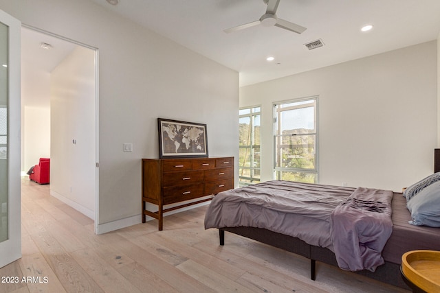 bedroom featuring ceiling fan and light hardwood / wood-style flooring