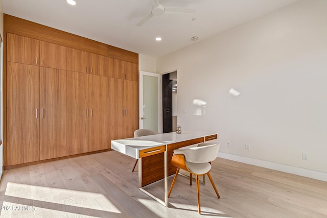 unfurnished dining area featuring light hardwood / wood-style flooring and ceiling fan