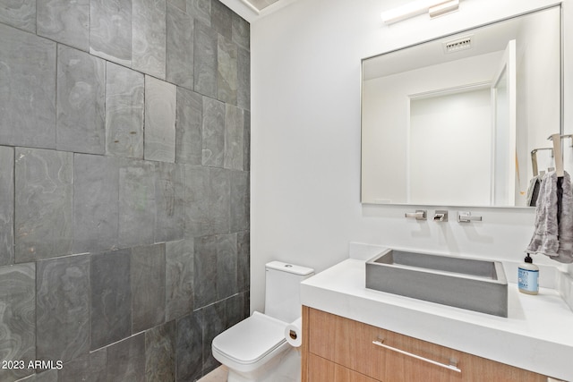 bathroom with toilet and vanity