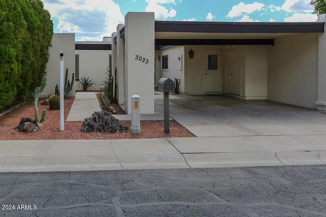 view of front of house with a carport