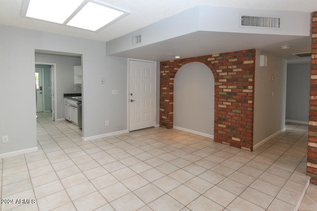 spare room with light tile patterned floors