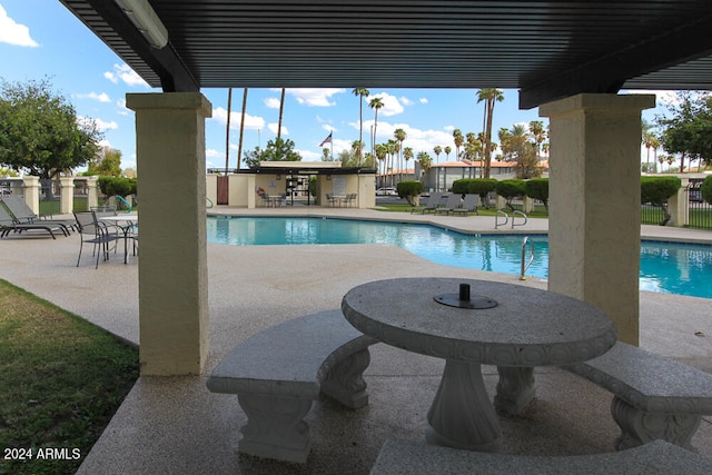 view of swimming pool featuring a patio