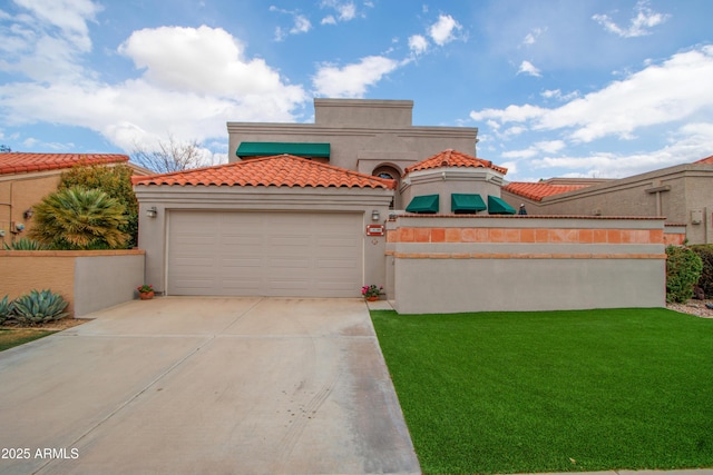 mediterranean / spanish-style home with a front lawn and a garage