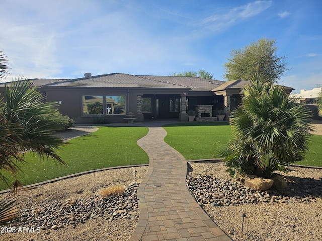 rear view of house with a lawn