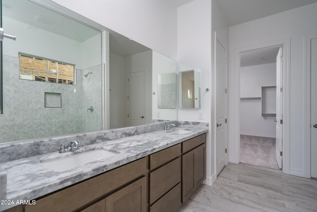 bathroom with a shower and vanity