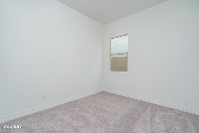 empty room with light colored carpet