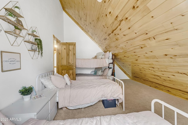bedroom featuring carpet flooring, wood ceiling, and vaulted ceiling
