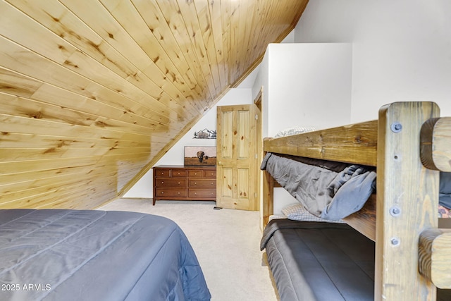bedroom featuring vaulted ceiling, carpet, and wooden ceiling