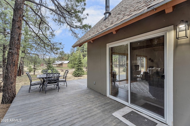 wooden deck featuring outdoor dining space