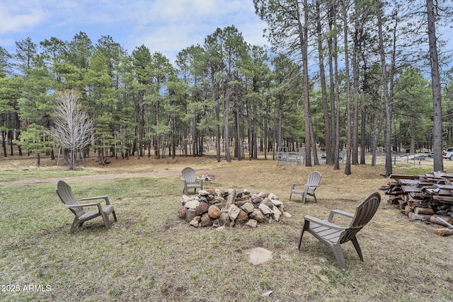 view of yard with an outdoor fire pit