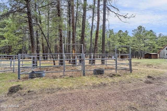 view of yard with an outdoor structure and fence