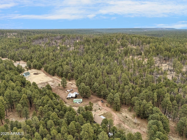 drone / aerial view with a view of trees