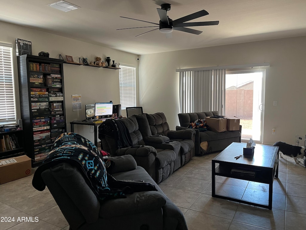 tiled living room featuring ceiling fan