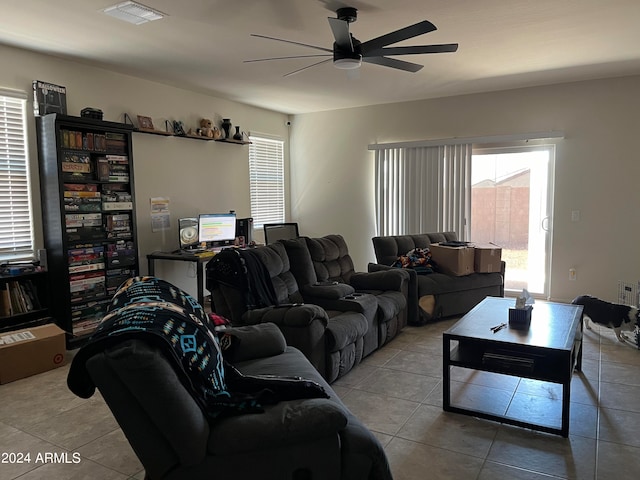 tiled living room featuring ceiling fan