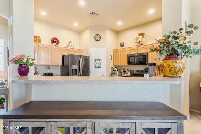 2675 Tarina Way, Sierra Vista, AZ 85650 - kitchen with appliances with stainless steel finishes, light brown cabinetry, a peninsula, a sink, and recessed lighting
