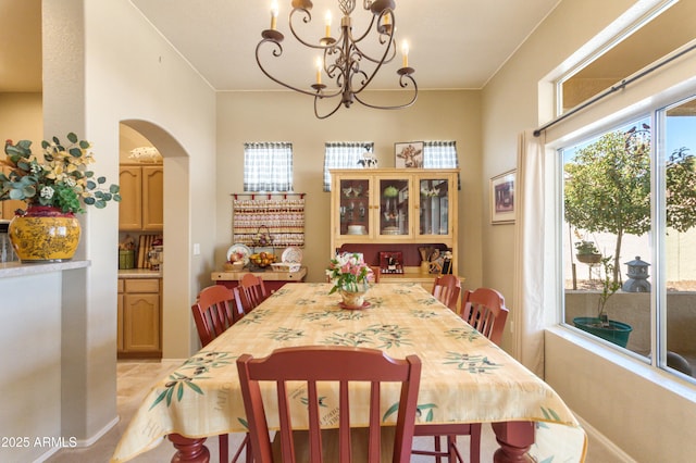 2675 Tarina Way, Sierra Vista, AZ 85650 - dining space featuring a chandelier and arched walkways