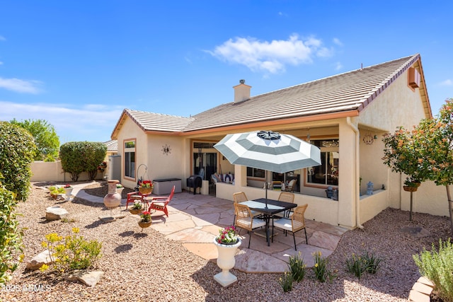 2675 Tarina Way, Sierra Vista, AZ 85650 - back of house with a patio, a chimney, a tiled roof, and stucco siding