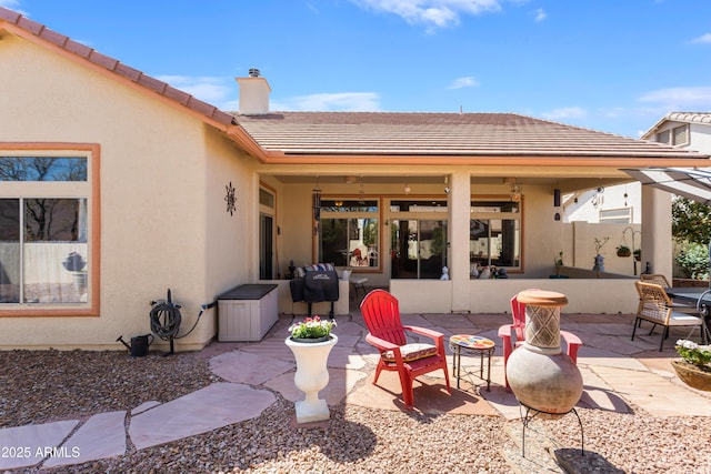 2675 Tarina Way, Sierra Vista, AZ 85650 - back of property with a patio area, a chimney, a tile roof, and stucco siding