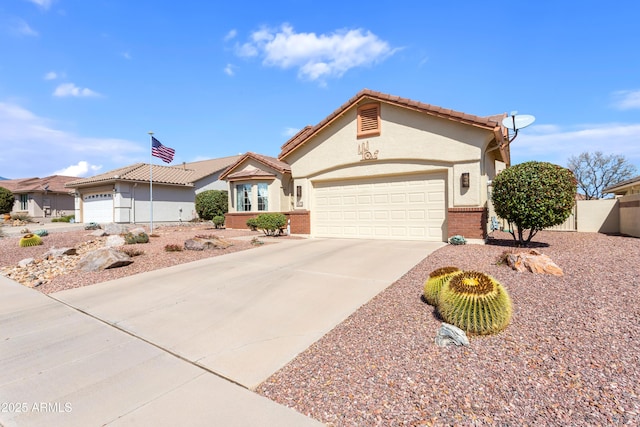 2675 Tarina Way, Sierra Vista, AZ 85650 - single story home with a garage, concrete driveway, stucco siding, brick siding, and fence