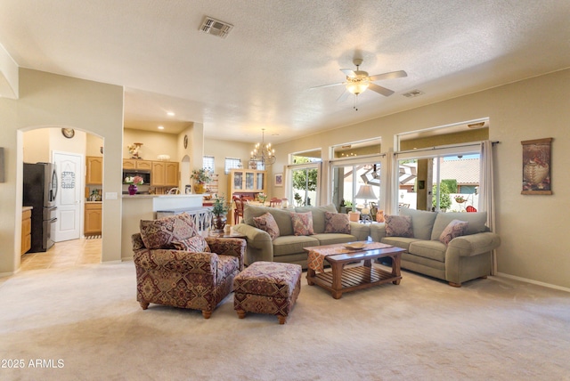 2675 Tarina Way, Sierra Vista, AZ 85650 - living room with light carpet, a ceiling fan, a chandelier, arched walkways, and baseboards
