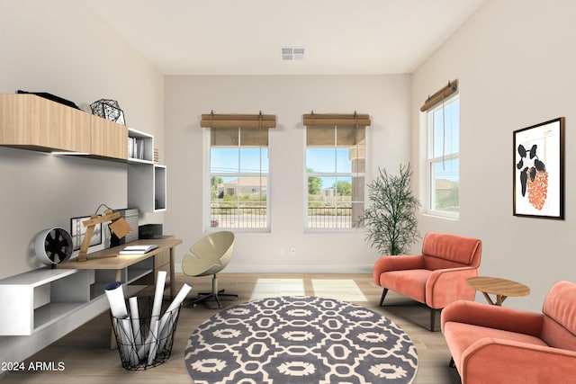 home office featuring baseboards, visible vents, and light wood-style floors