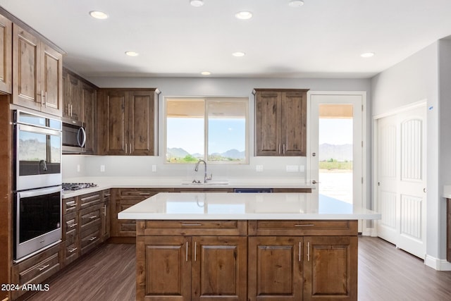 kitchen featuring a sink, light countertops, and a kitchen island