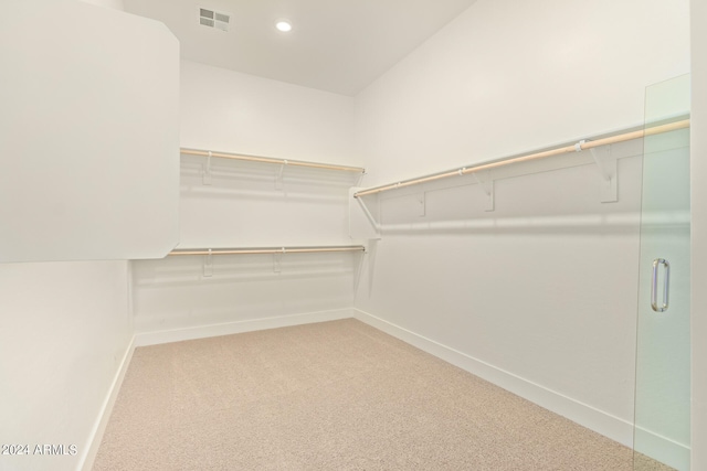 spacious closet with carpet floors and visible vents