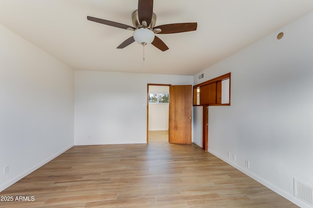 unfurnished room featuring ceiling fan and light hardwood / wood-style flooring