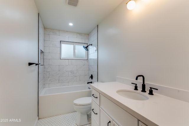 full bathroom with tile patterned floors, vanity, toilet, and tiled shower / bath