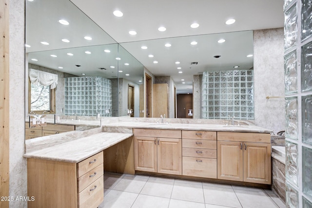 bathroom featuring vanity, tile patterned floors, and tile walls