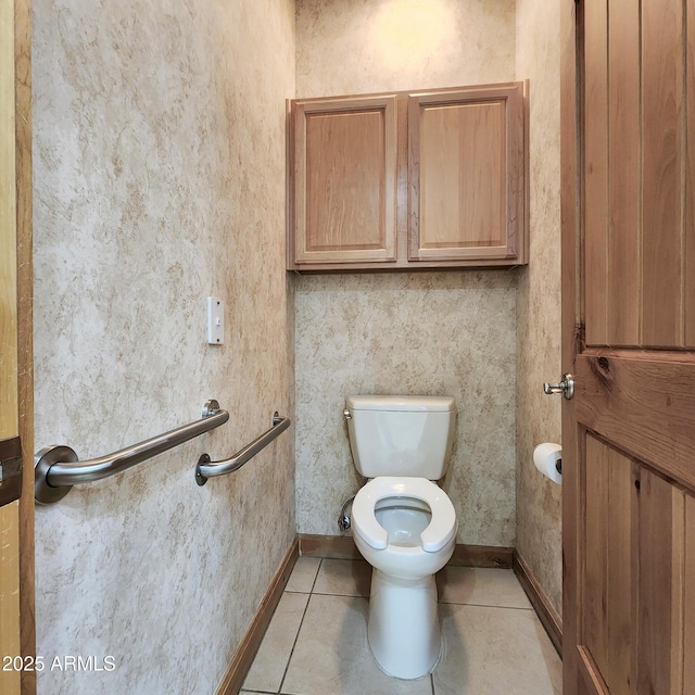 bathroom featuring tile patterned flooring and toilet