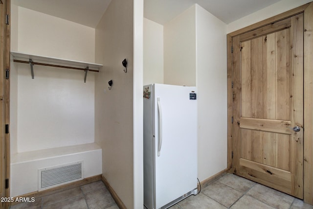 interior space featuring light tile patterned floors