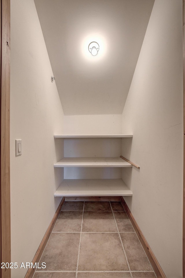 spacious closet featuring vaulted ceiling