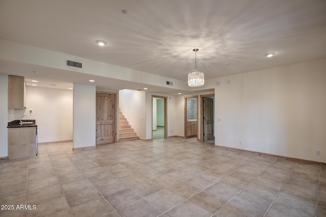 empty room with a chandelier