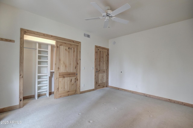 unfurnished bedroom featuring ceiling fan and light colored carpet