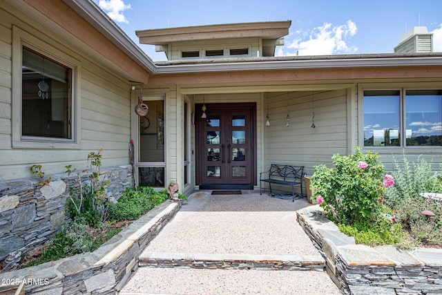 view of exterior entry featuring french doors