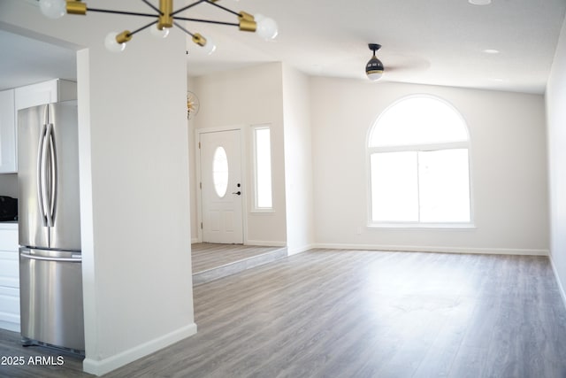 1632 E Saint Charles Ave, Phoenix, AZ 85042 - unfurnished living room with a chandelier and wood finished floors