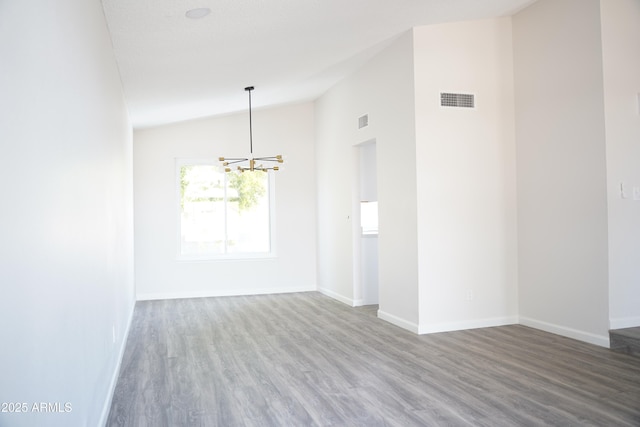 1632 E Saint Charles Ave, Phoenix, AZ 85042 - spare room featuring a chandelier, lofted ceiling, and wood finished floors