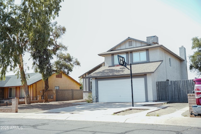 1632 E Saint Charles Ave, Phoenix, AZ 85042 - tudor-style house with a chimney, driveway, and an attached garage