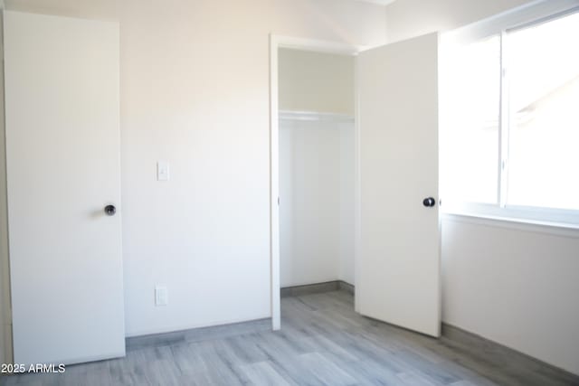 1632 E Saint Charles Ave, Phoenix, AZ 85042 - unfurnished bedroom with a closet and wood finished floors