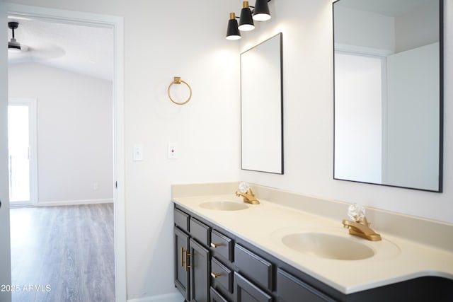 1632 E Saint Charles Ave, Phoenix, AZ 85042 - full bath featuring double vanity, wood finished floors, and lofted ceiling